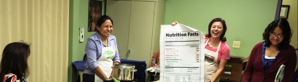 Facilitators engage students in a discussion about nutrition fact labels. (Photo courtesy of The Happy Kitchen)
